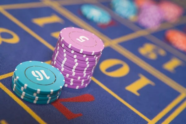 Multi camera live dealer studio with baccarat and roulette tables